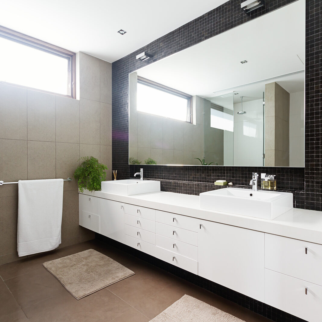 Black Mosaic Tiled Splashback And Double Basin Bathroom Black mosaic tiled splashback and double basin bathroom ensuite